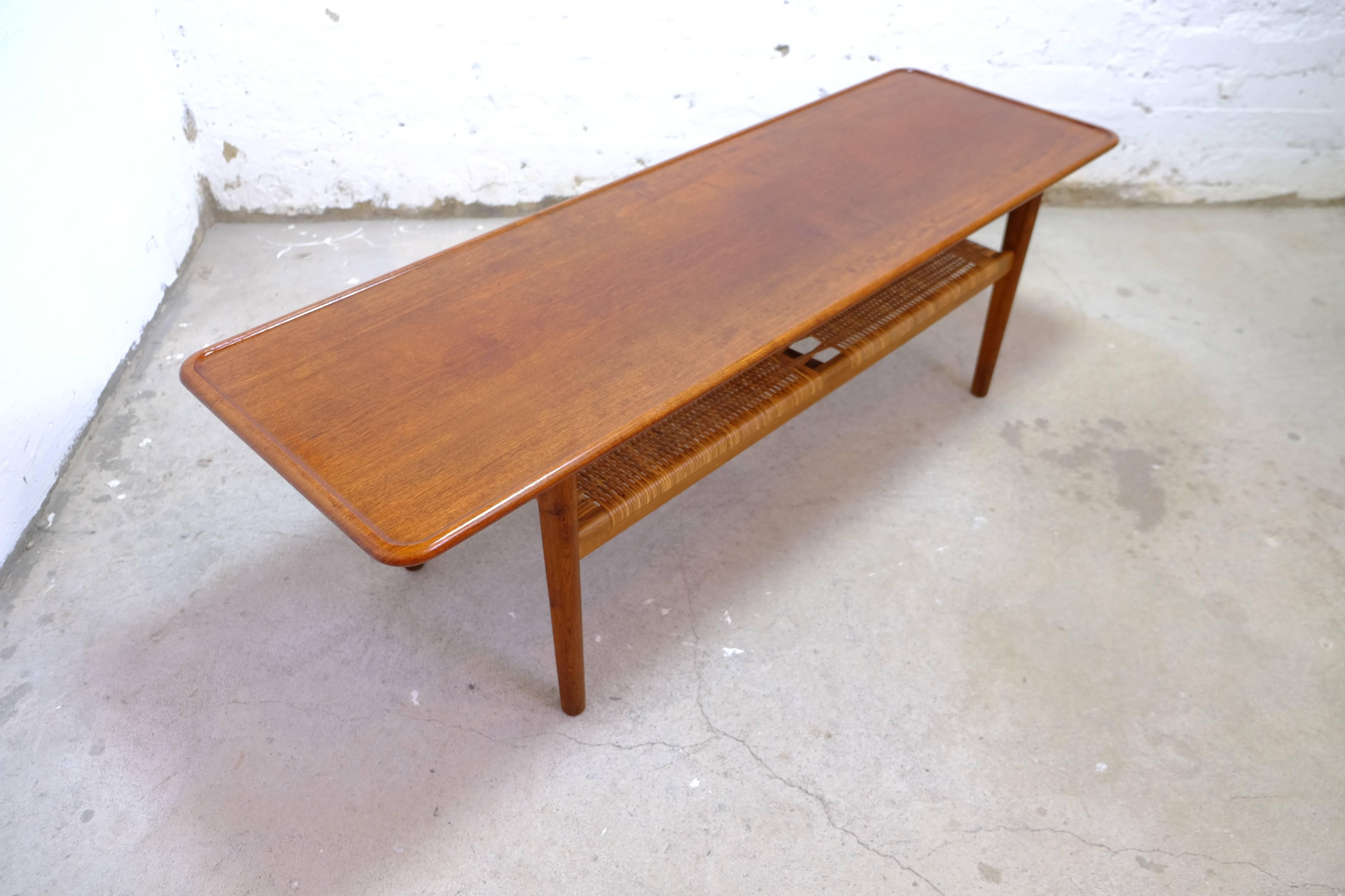 Coffee table model AT-10 design Hans J. Wegner.
Teak and cane, produced by Andreas Tuck in Denmark, 1950's.