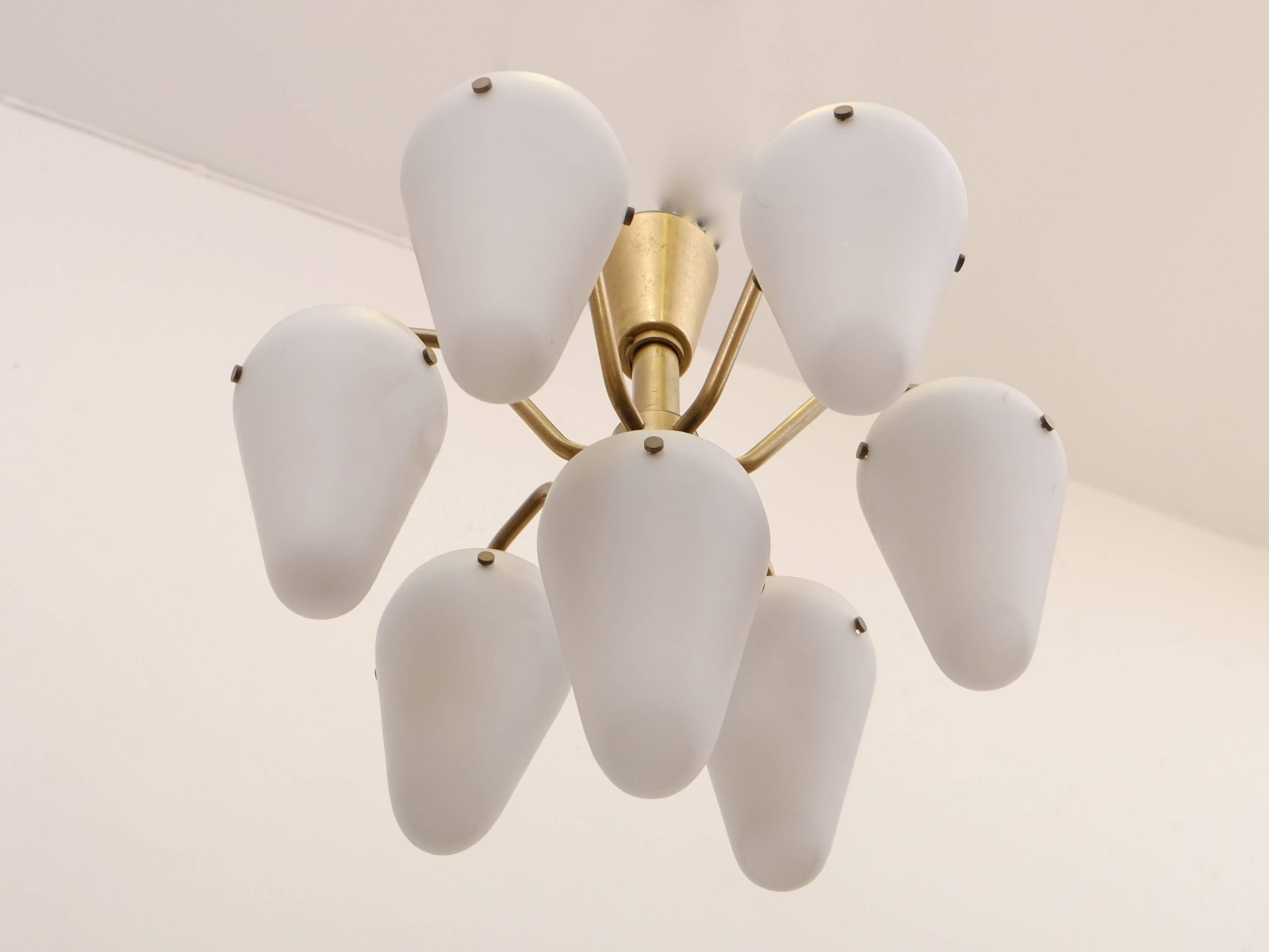 Rare and early seven-armed chandelier in brass and opaline glass. Produced by Hans-Agne Jakobsson AB in Markaryd, Sweden, late 1950s.