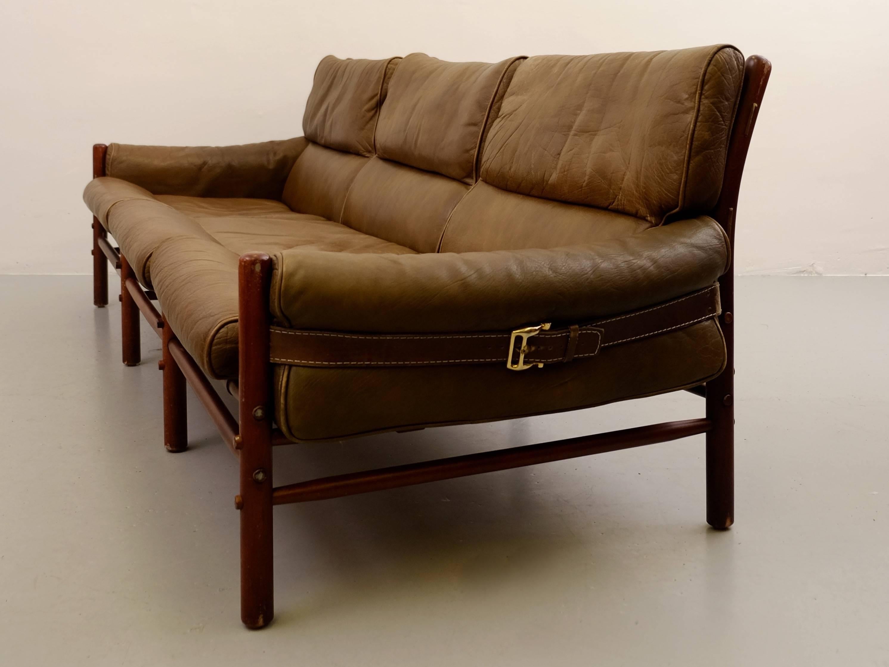 Original brown leather three-seat sofa model Kontiki designed by Arne Norell. Produced by Arne Norell AB in Aneby, Sweden.
Excellent condition!
 