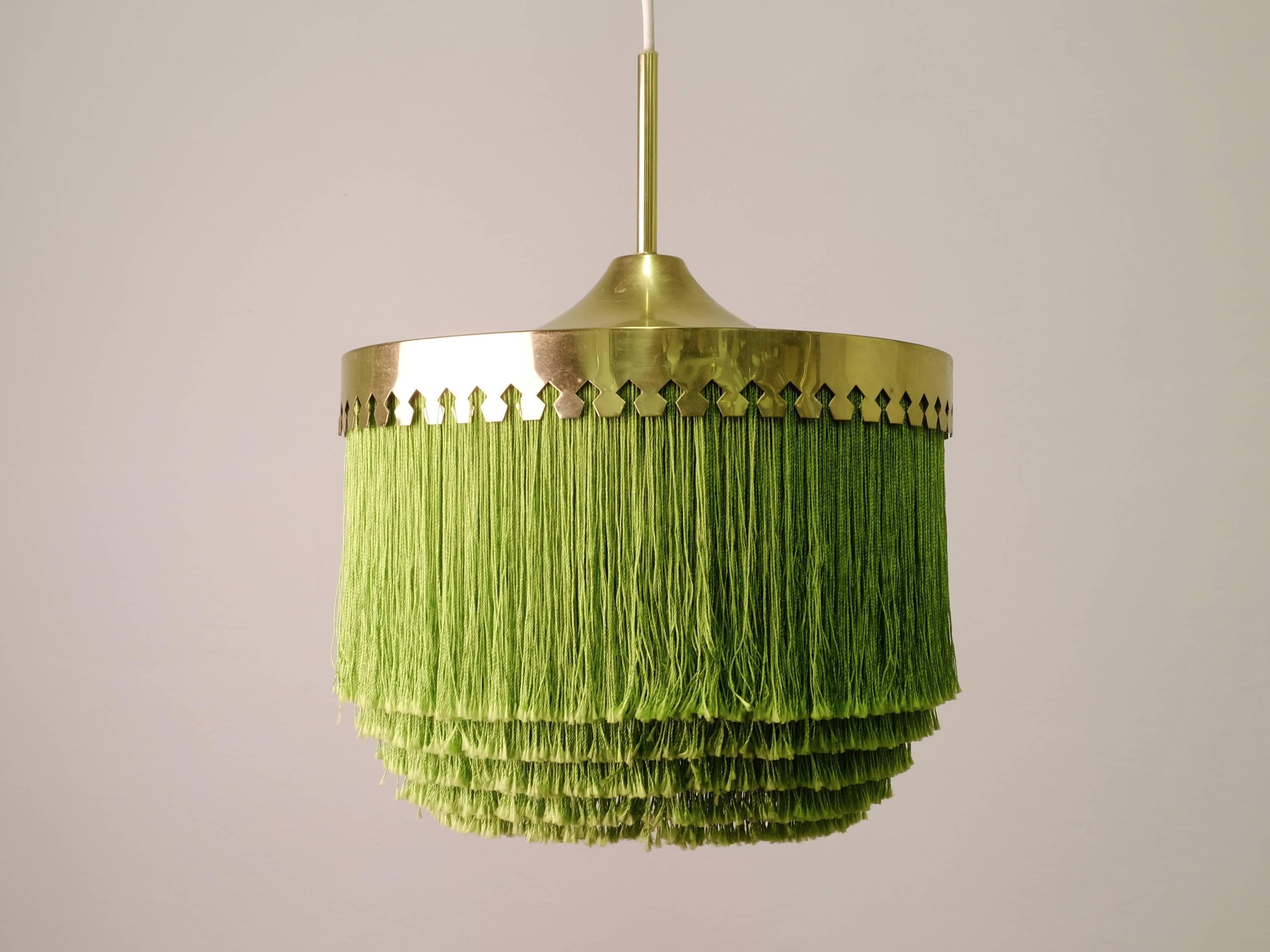 Green fringes and brass.
Produced by Hans-Agne Jakobsson, Markaryd, Sweden, 1960s.
Height is adjustable.