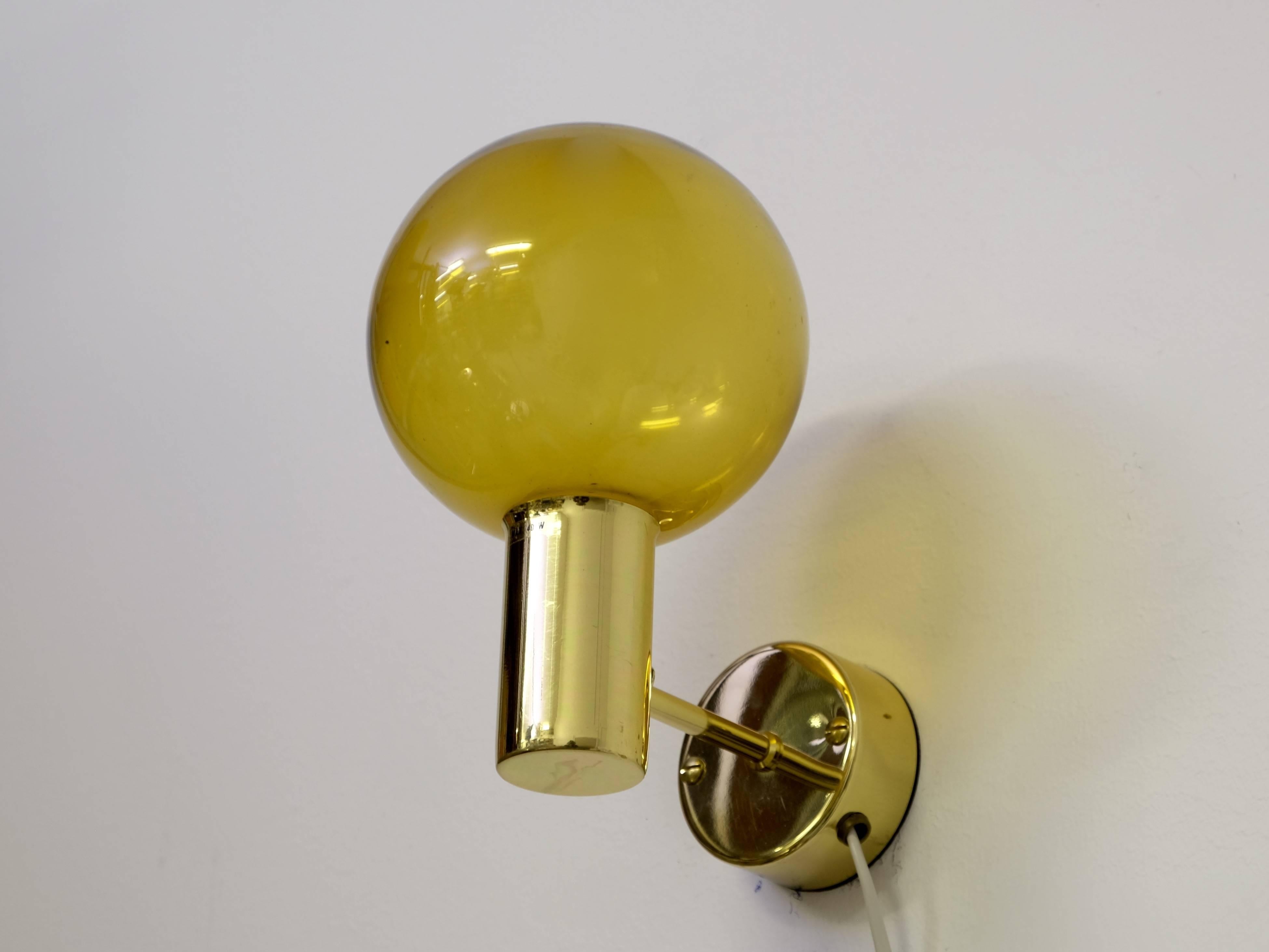 Rare set of four brass and smoked glass wall lights.
Produced by Hans-Agne Jakobsson, Markaryd, Sweden, 1960s.