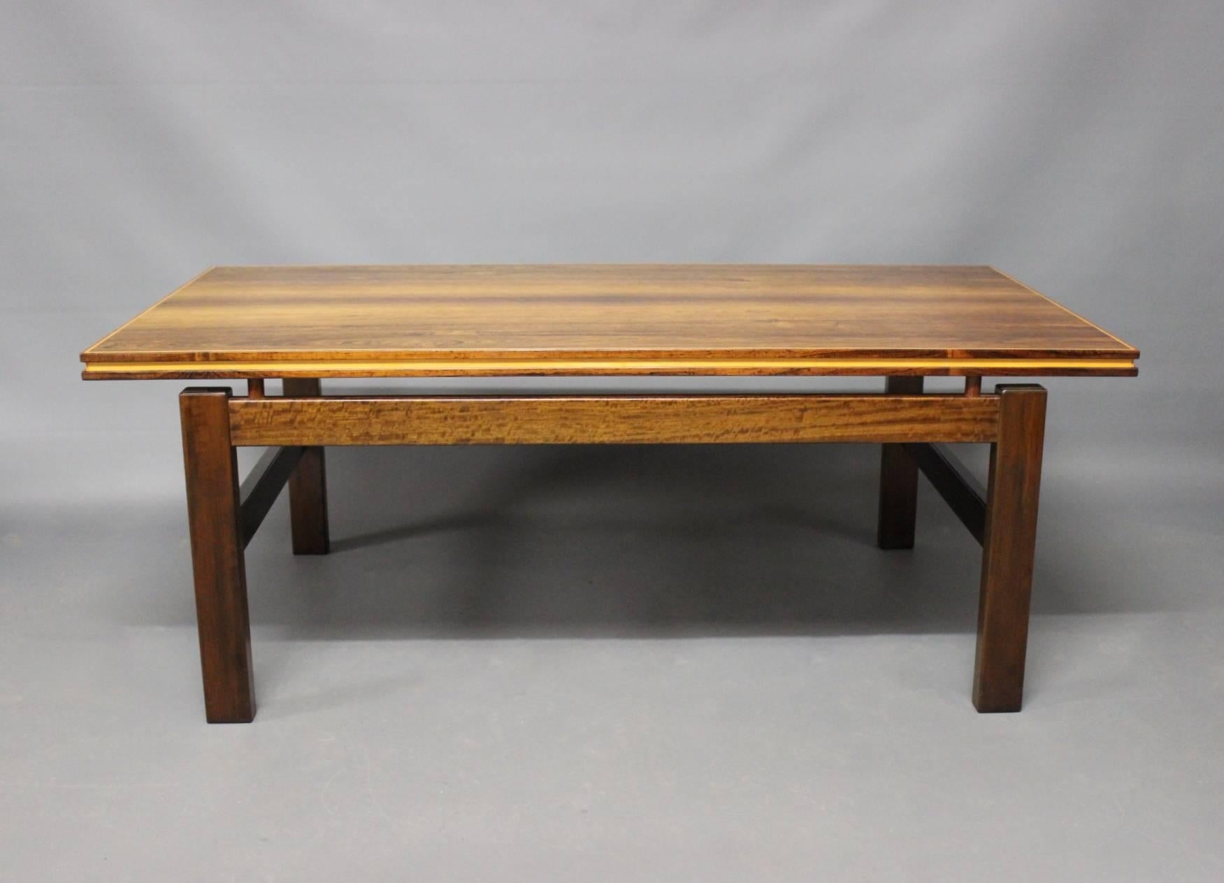 Exquisite Danish Design Rosewood Coffee Table from the 1960s: A timeless piece that epitomizes the elegance and sophistication of mid-century craftsmanship.

Crafted from lustrous rosewood, this coffee table exemplifies the iconic design principles