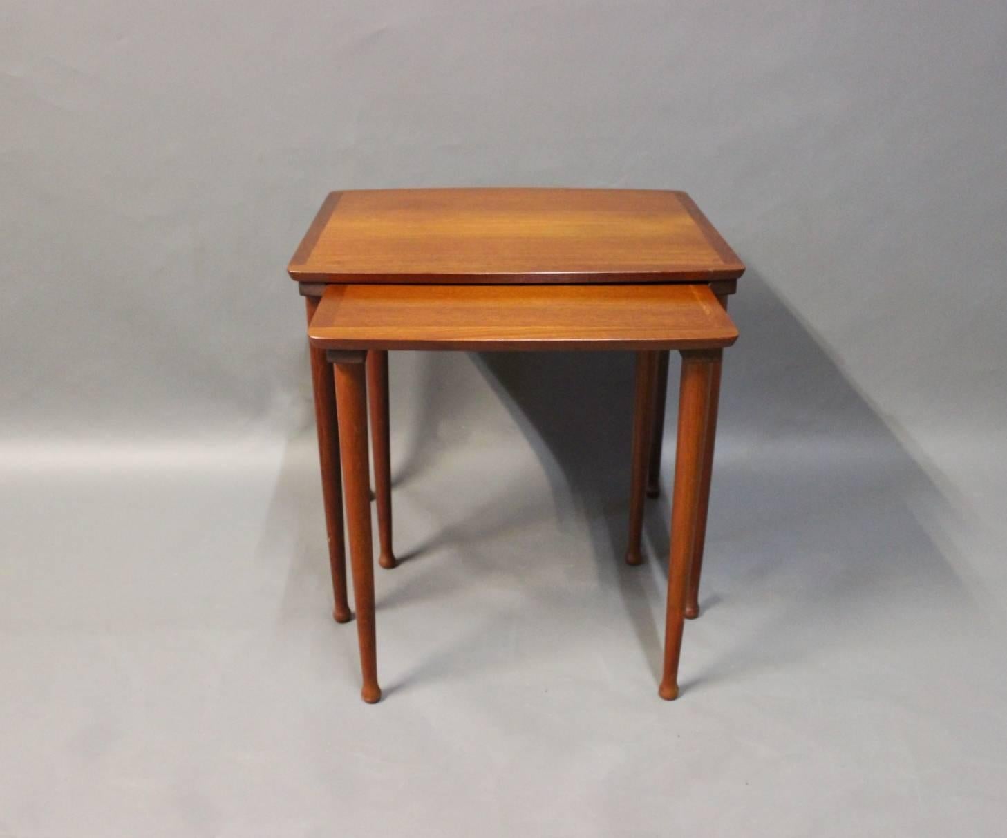 The set of nesting tables in teak manufactured by 