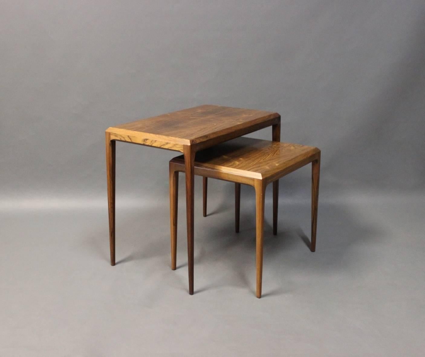 A set of nesting tables in rosewood designed by Johannes Andersen and manufactured by CFC Silkeborg in the 1960s.
Measurements for the smaller table:
H - 42 cm, W - 44 cm and D - 36 cm.