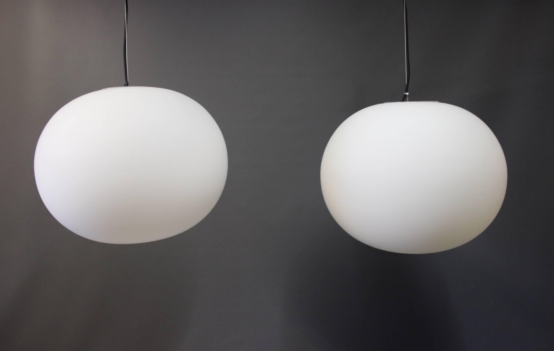A pair of Glo-ball pendants designed by Jasper Morrison in 1998 for the Italian manufacturer Flos. The pendants are in great condition.