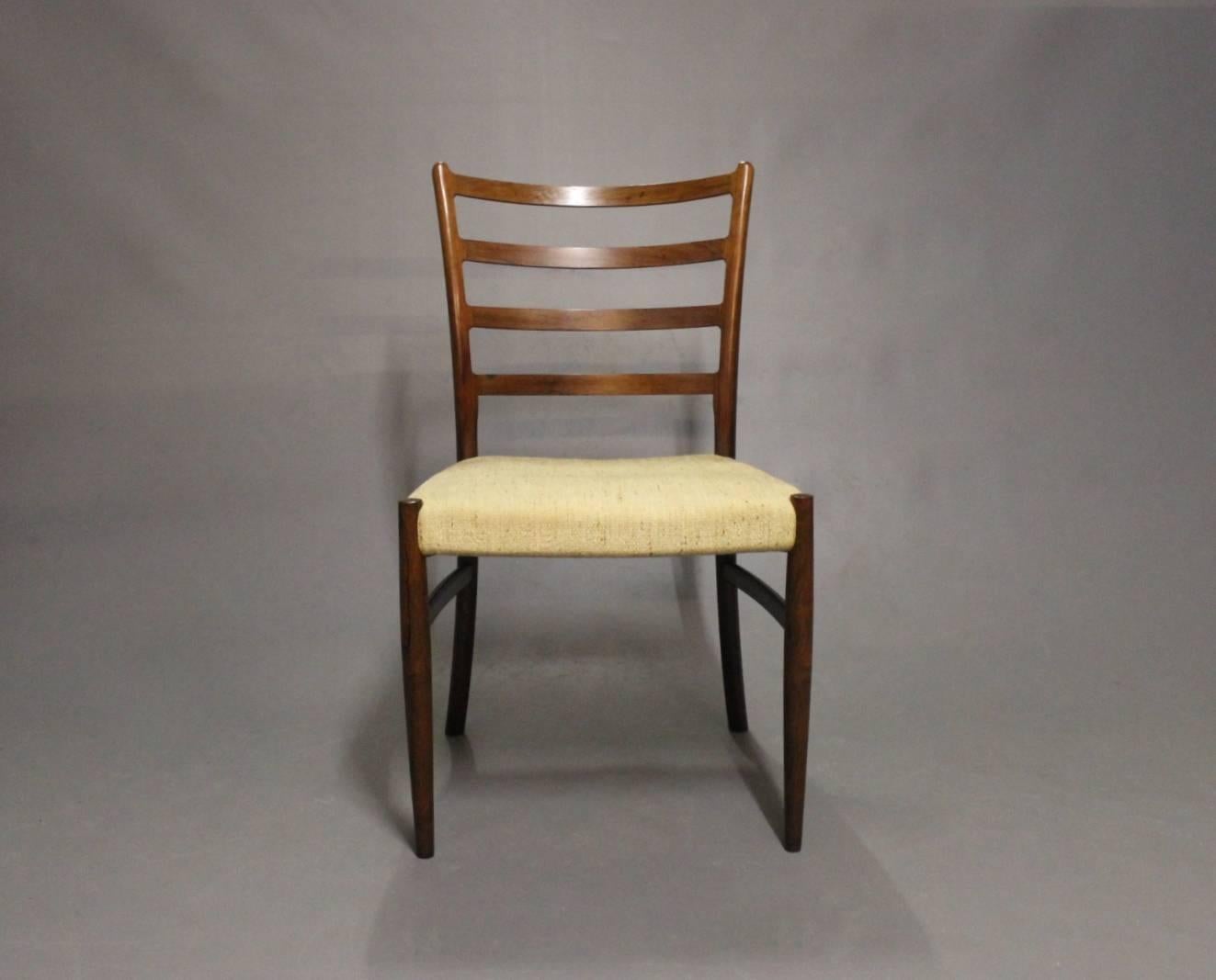 A set of six dining room chairs in rosewood and light wool designed by N. O. Møller from the 1960s. We have 8 in total.