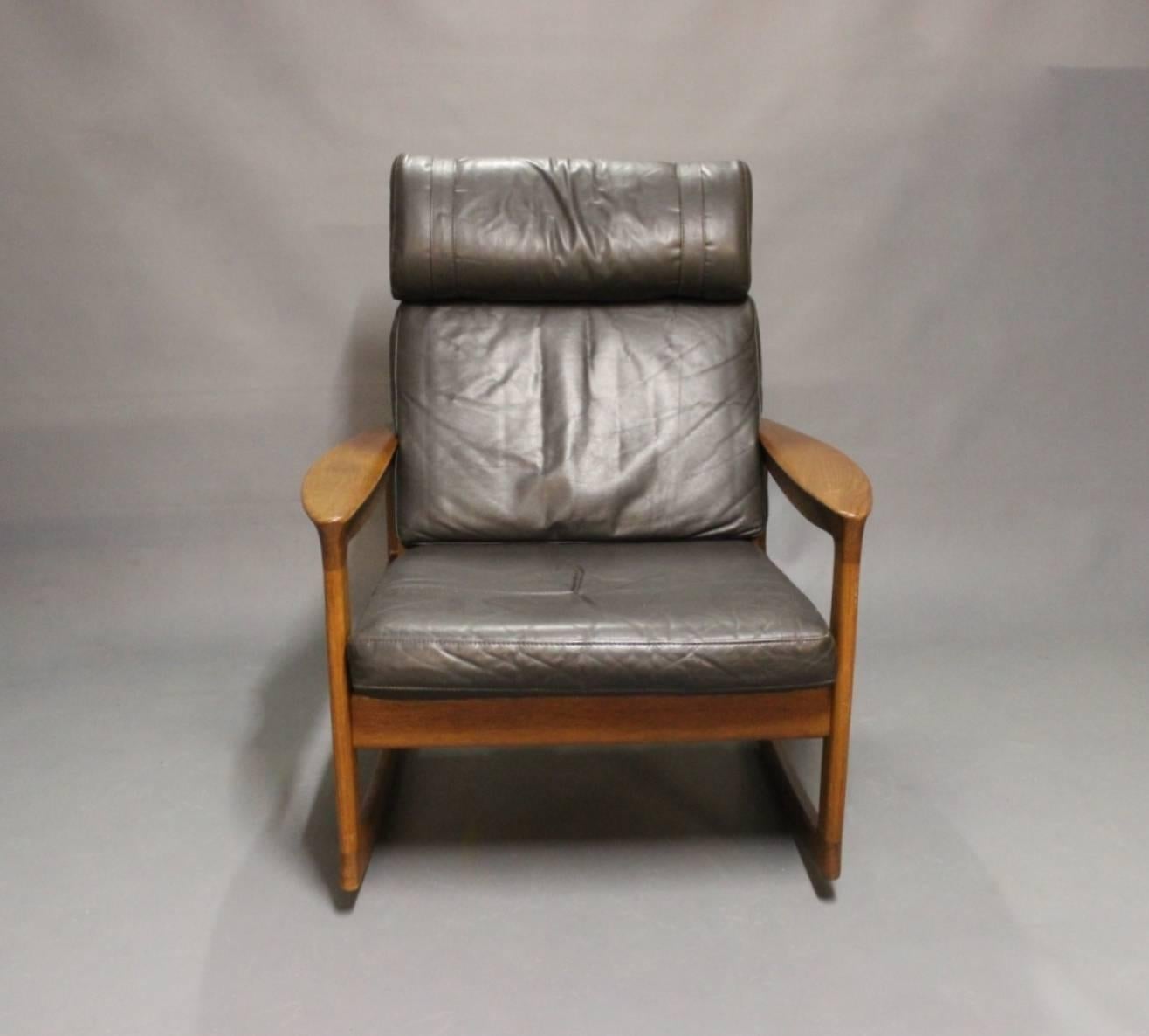 Rocking chair in teak and black Classic leather designed by Ole Wanscher and manufactured at Komfort furniture factory in the 1960s. We have a matching sofa, easy chair and stool in stock.