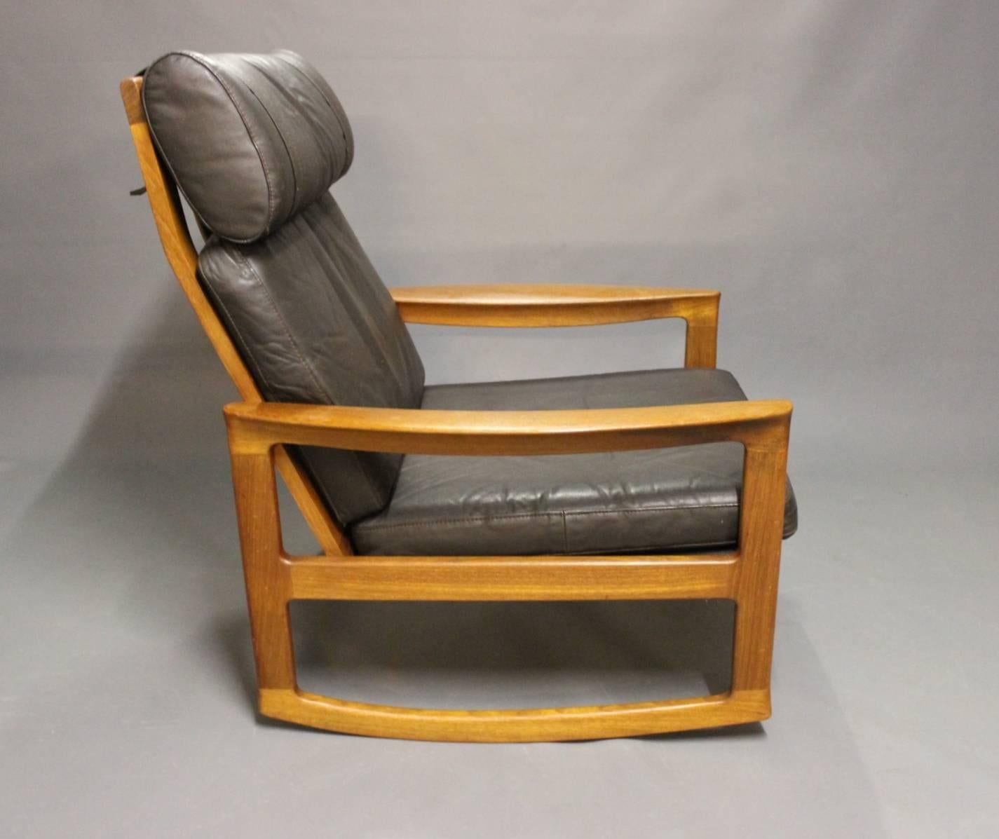 Scandinavian Modern Rocking Chair in Teak and Black Leather by Ole Wanscher and Komfort, 1960s