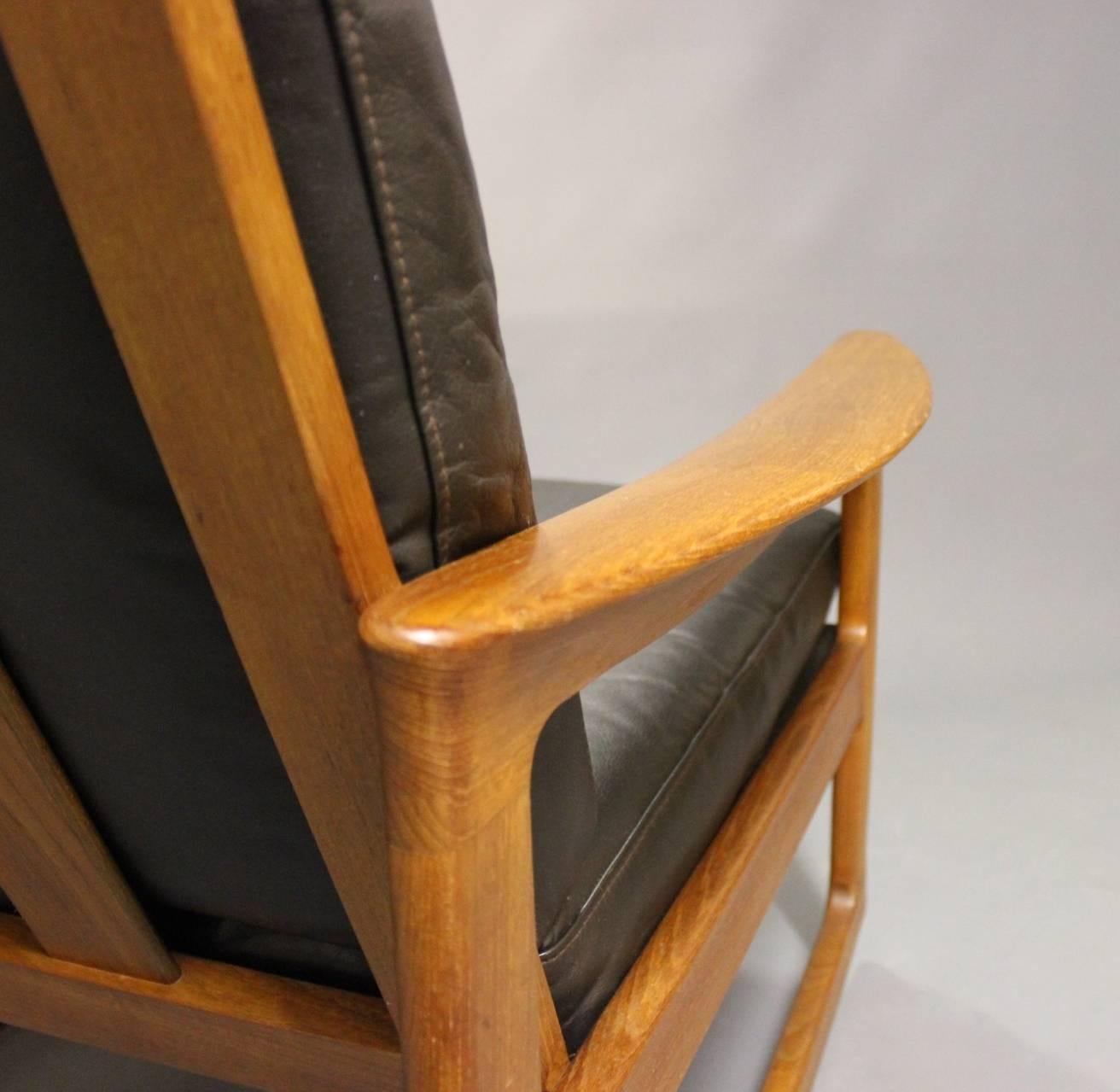 Mid-20th Century Rocking Chair in Teak and Black Leather by Ole Wanscher and Komfort, 1960s
