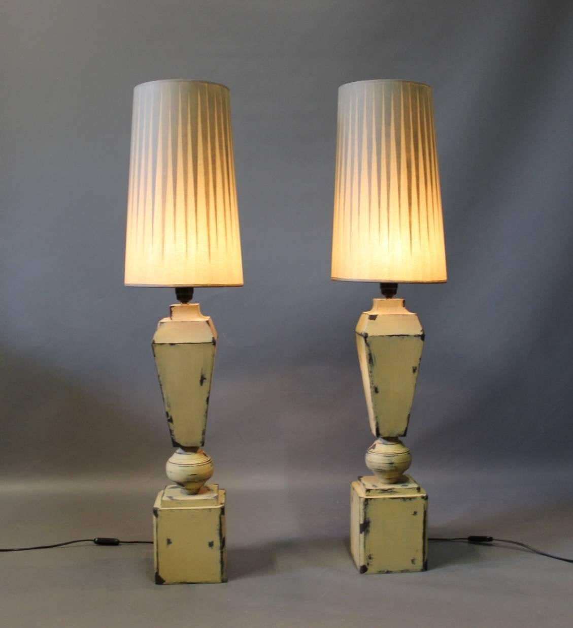 Tall tablelamps of painted metal with grey lamp shades of an unknown designer. The lamps are from around the 1960s.