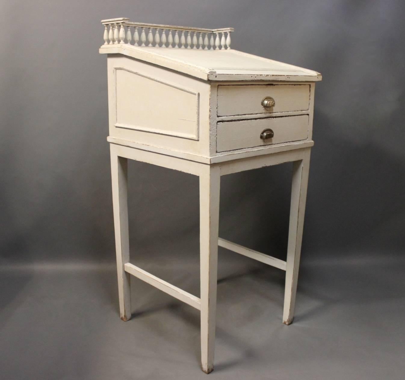 A grey painted writing desk in the Gustavian style from the 1840s is a captivating piece that reflects the aesthetics and craftsmanship of its time.

The Gustavian style originated in Sweden during the late 18th century and is characterized by its