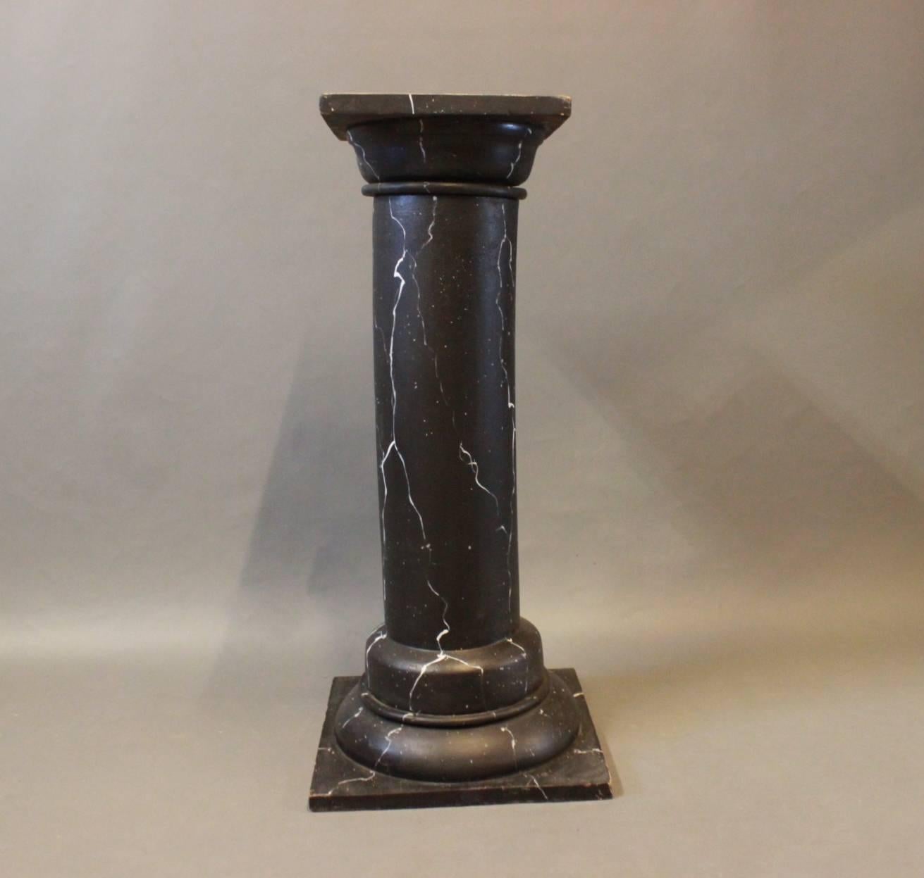 This marbled pedestal, dating back to the circa 1930s, exudes a timeless charm with its striking black and white painted wood construction. Its marbled appearance adds an elegant touch to any space, evoking a sense of sophistication and classic