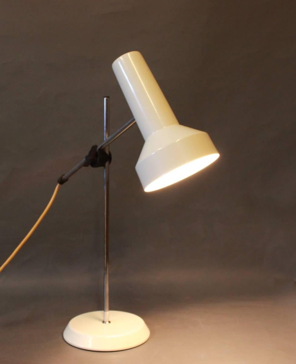 Desk lamp with white lacquered shade and foot. The lamp is of Danish design from the 1960s.