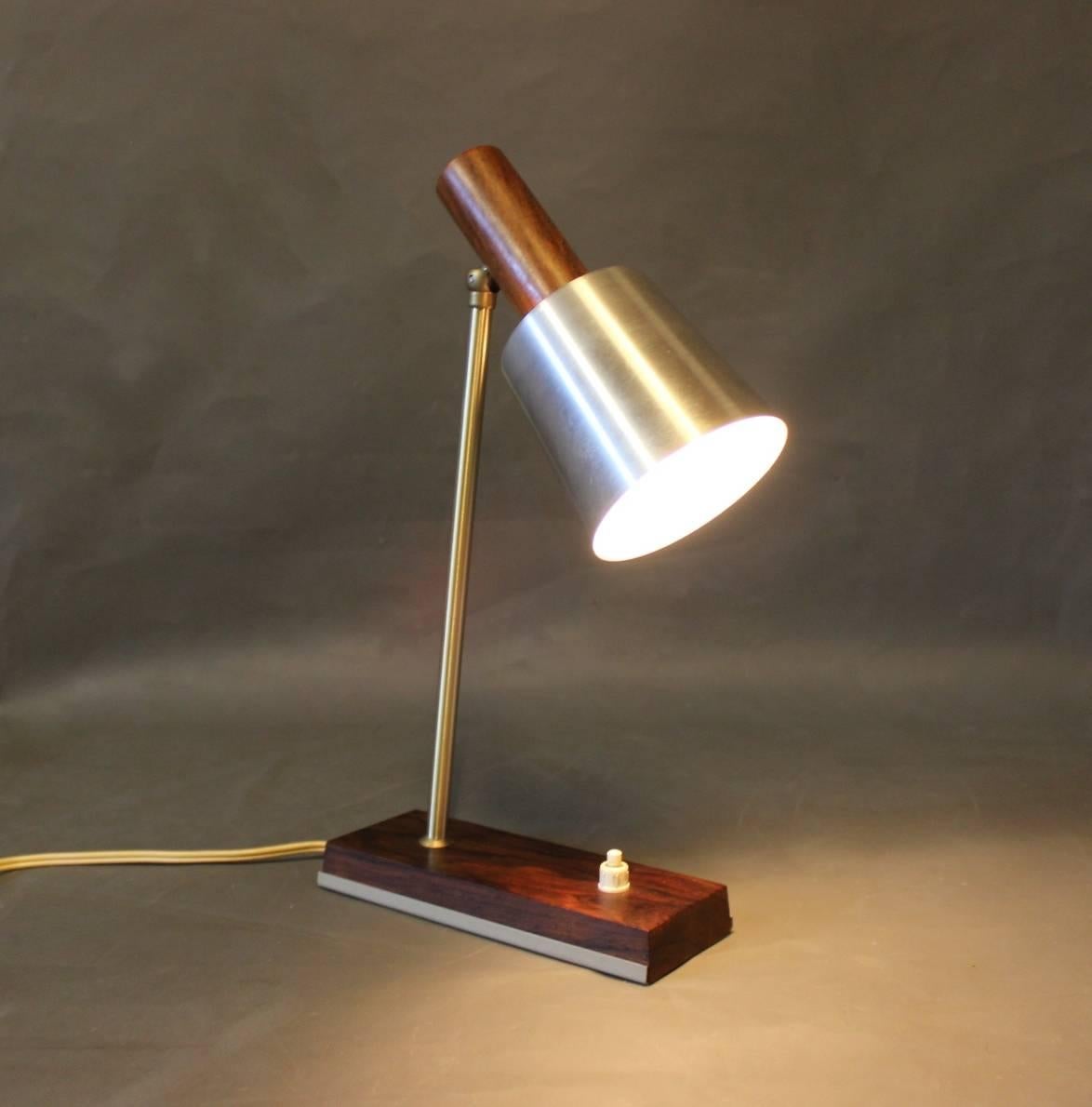 Small table lamp with shade of steel and frame of teak. The lamp is of Danish design from the 1960s.