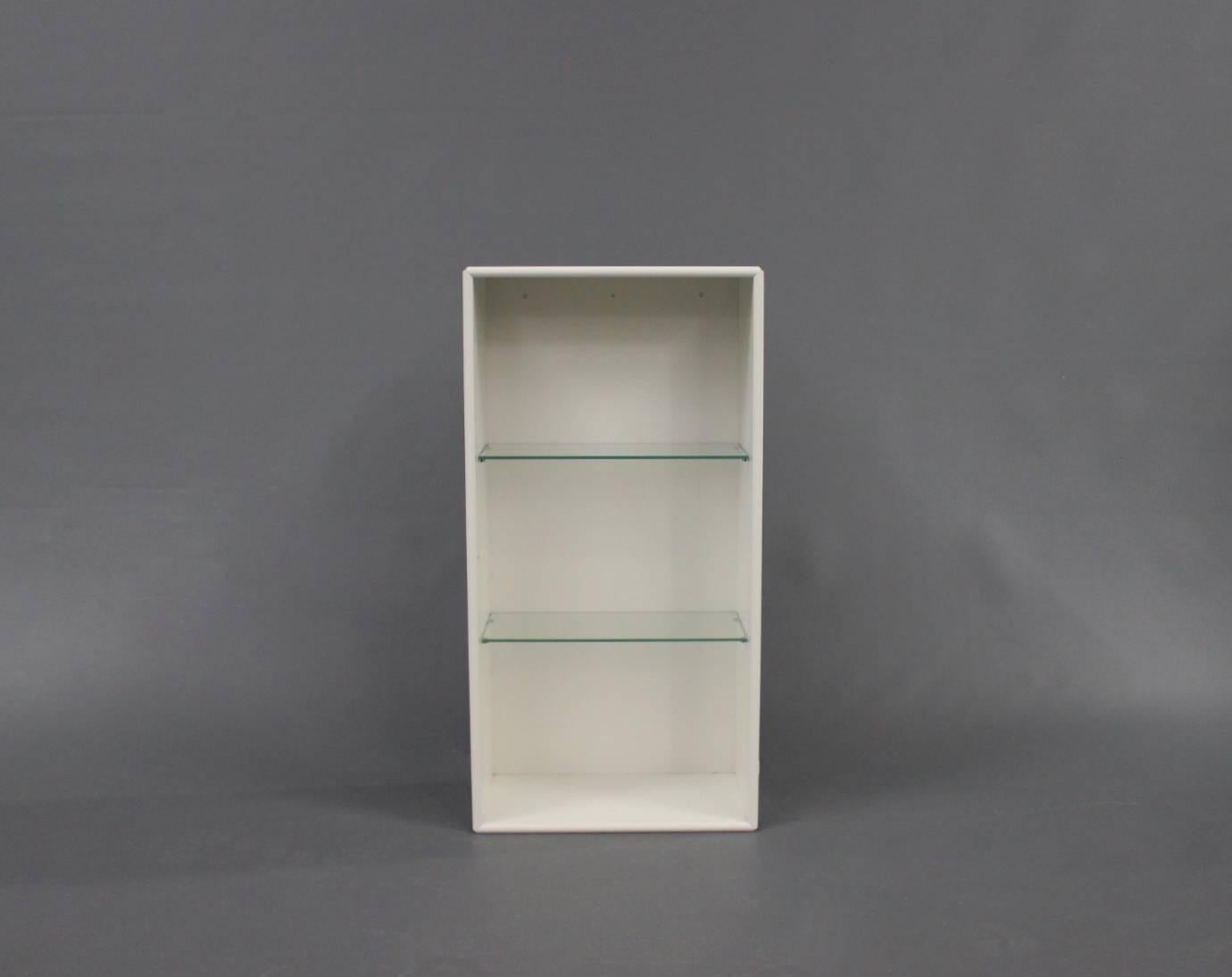 white bookcase with glass shelves