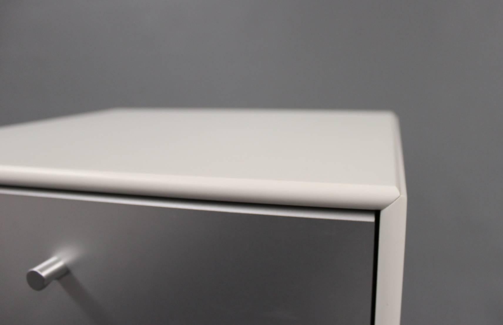 white bookcase with glass doors and drawers