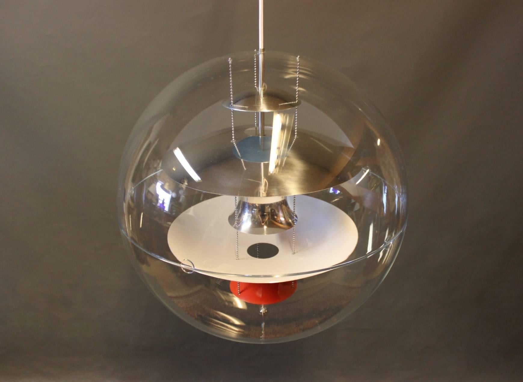 Globe, Ø60, designed by Verner Panton in 1969 and manufactured by VerPan in the 1980s. The lamp is a transparent acrylic globe with five hanging metal reflectors, which is lacquered in white, blue and red.