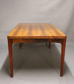 Dining Table in Sunfaded Rosewood with Extensions by Henning Kjærnulf, 1960s