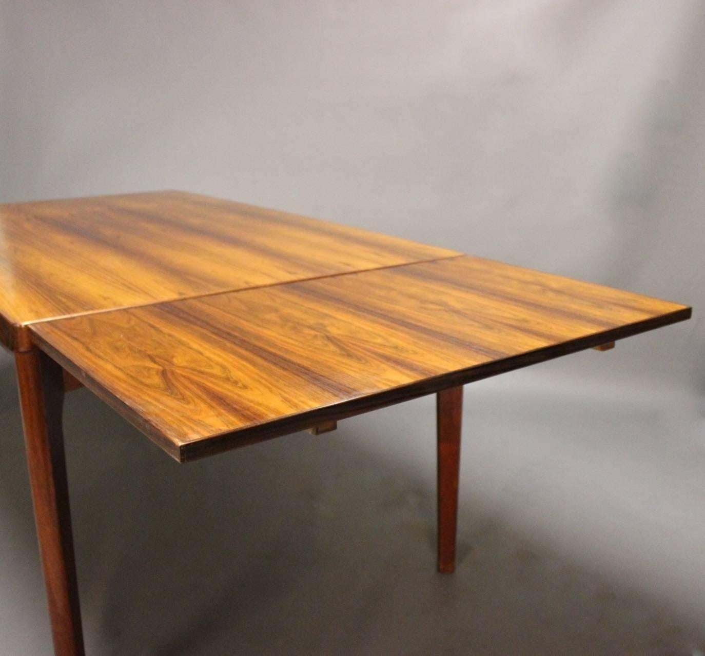 Scandinavian Modern Dining Table in Sunfaded Rosewood with Extensions by Henning Kjærnulf, 1960s