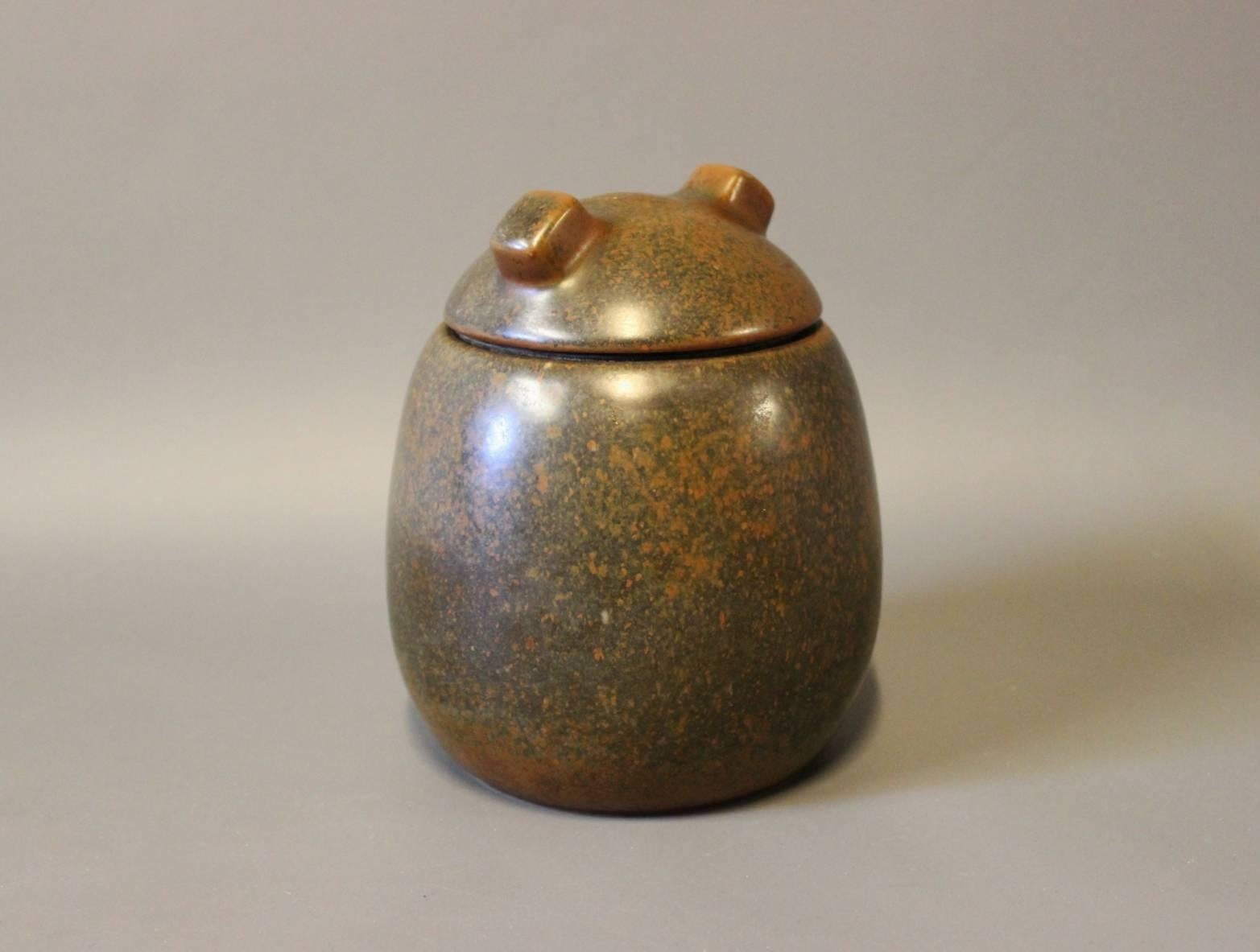 Ceramic lidded jar with dark brown glaze designed by Erik Rahr for Saxbo. The jar is numbered 28 and in great vintage condition.