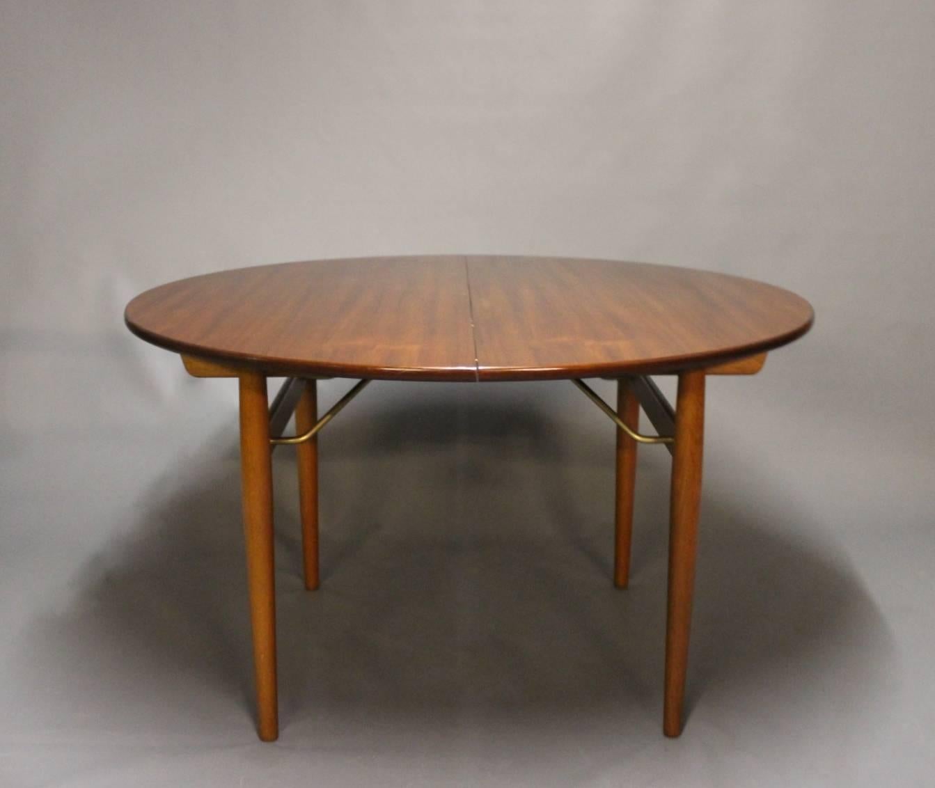 Danish Round Dining Table with Extensions in Teak and Oak by Hans J. Wegner, 1960s