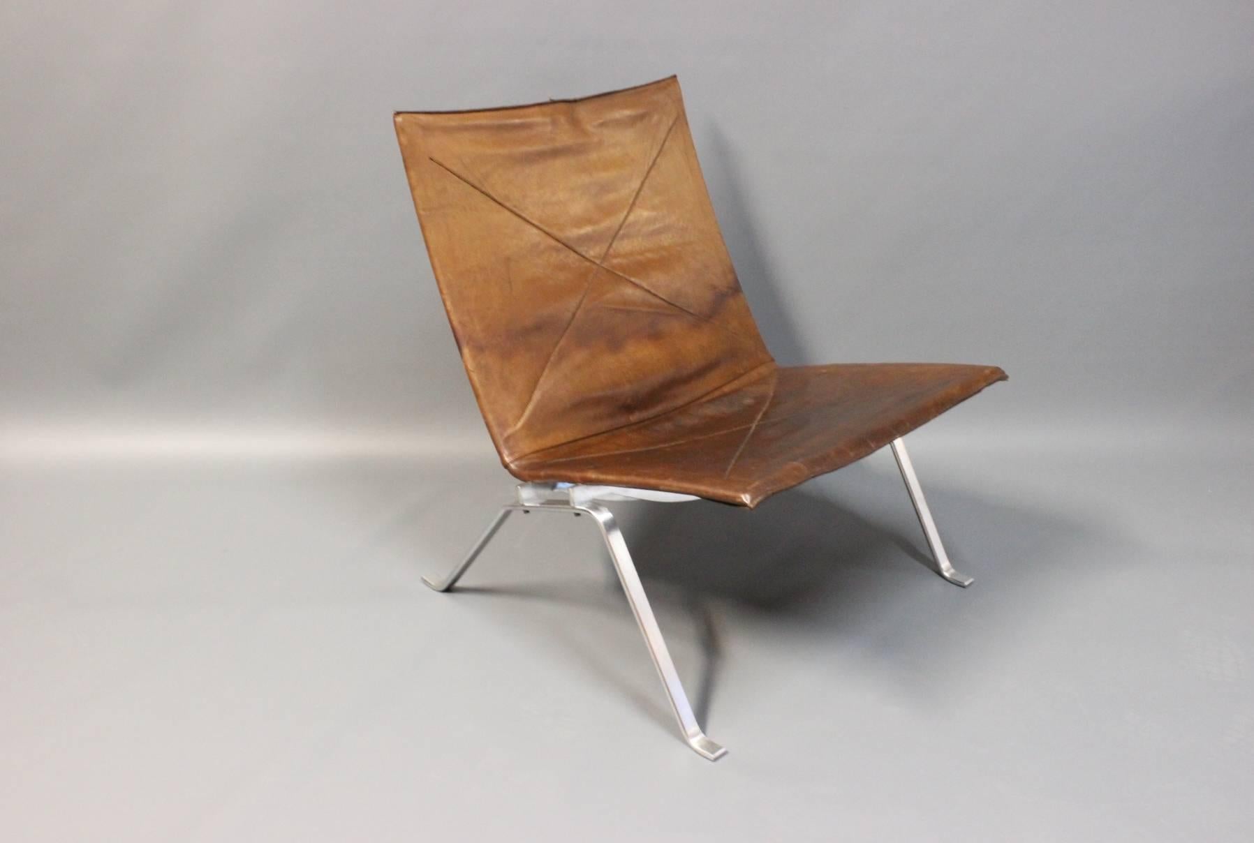 Easy Chair, model PK22, in original patinated leather and brushed steel designed by Poul Kjærholm in 1956 and manufactured by E. Kold Christensen c. 1960. 