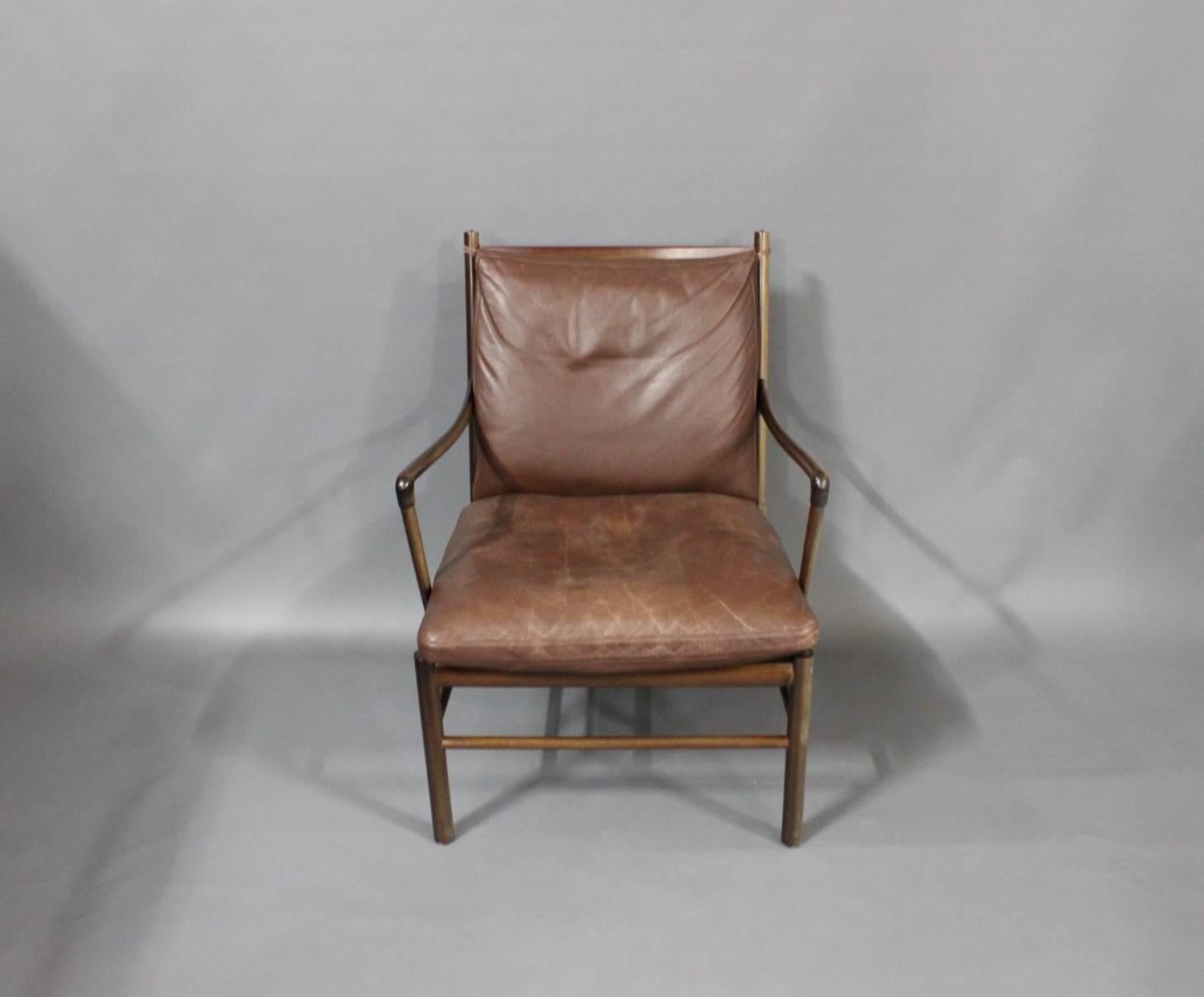 Colonial Chair, model PJ 149 designed by Ole Wanscher in 1949 and manufactured by P. Jeppesen. The chair is in mahogany and with Brown leather cushions. 
A matching ottoman is also available for purchase. 