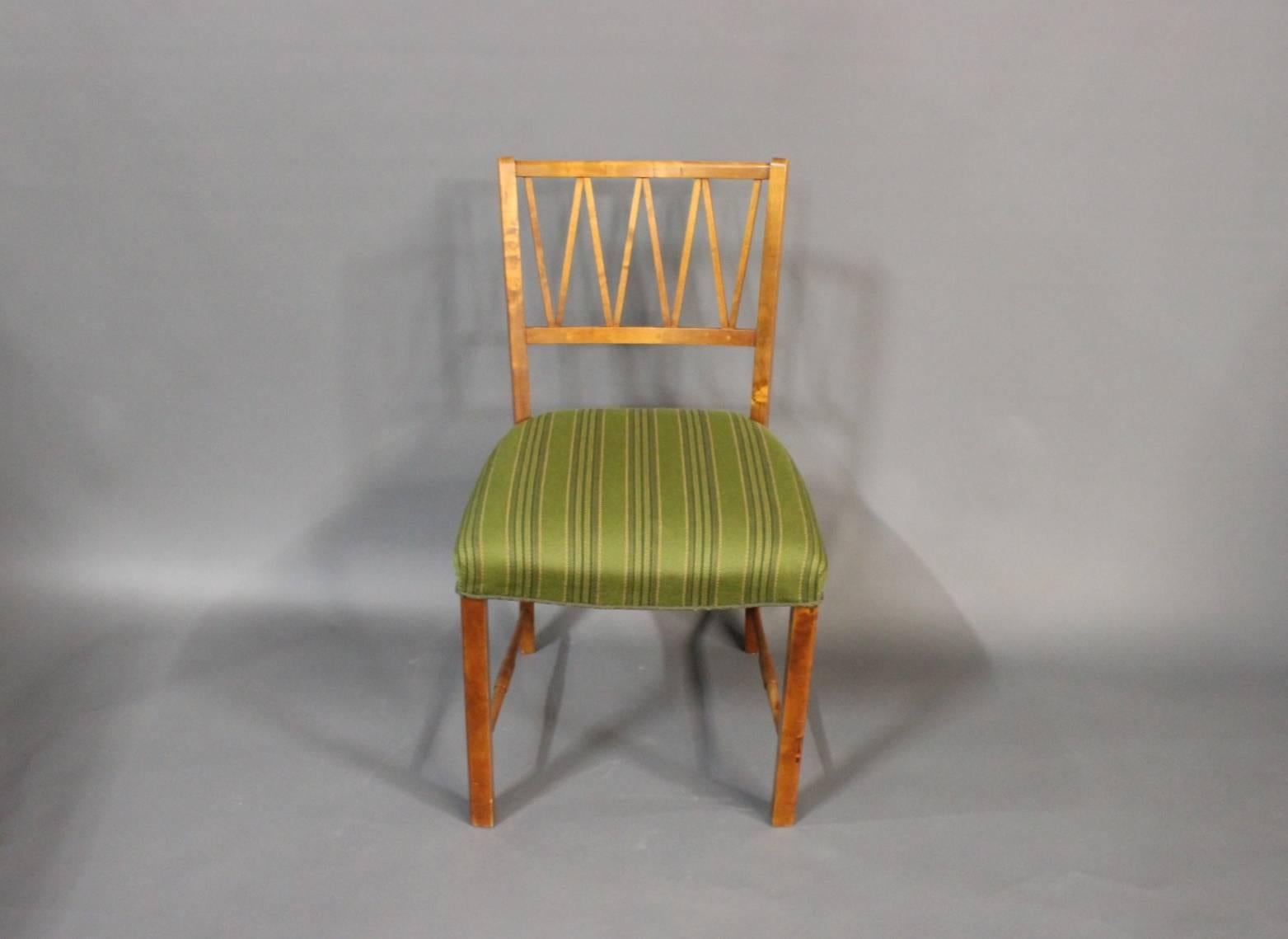 A set of six dining room chairs in walnut made by a Danish cabinetmaker around the 1940s. The chairs are of Danish design and upholstered with green fabric. The chairs will only be sold together. 