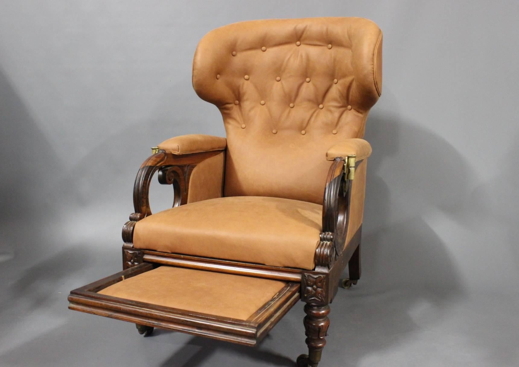 William IV open lounge chair in rosewood and leather with reclining back and sliding footrest by George Minter. The chair is from England and around the 1830s. The chair can be reclined even further. 