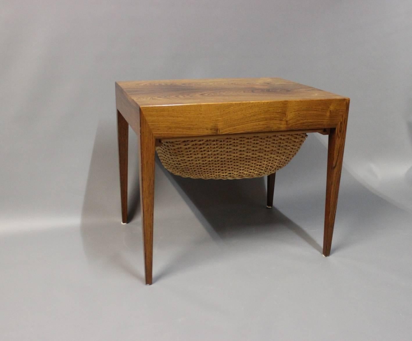 Small sewing table in rosewood and from the 1960s. The table was designed by Severing Hansen and manufactured by Haslev furniture factory. 