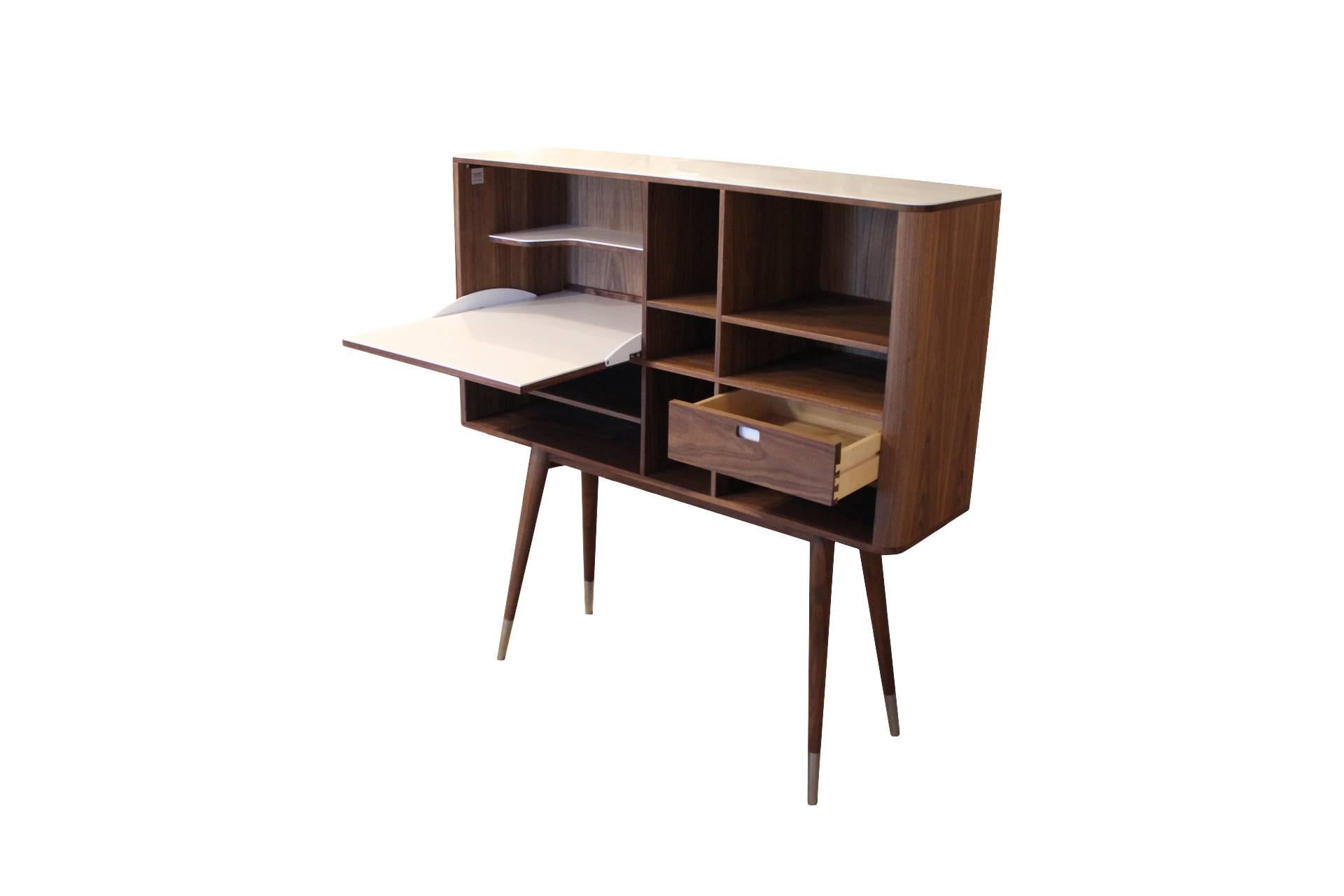 This beautiful sideboard is designed by furniture designer Ebbe Gehl. It is made from Walnut and with corian on the top of the cabinet and inside the room behind the flap lid. The sideboard can be used boft as a buffet or as a storage unit. The