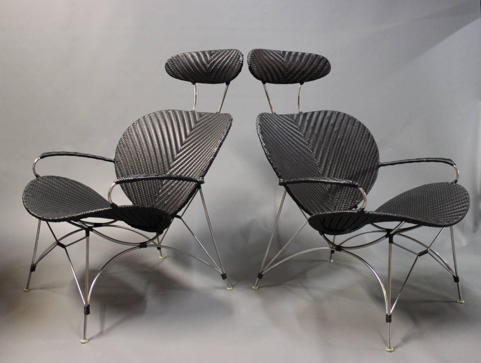 A pair of black lounge chairs by Yamakawa Contemporary Rattan with the serial no. 01-31330. The chairs are in black plait and frame of metal and from the 1980s.
