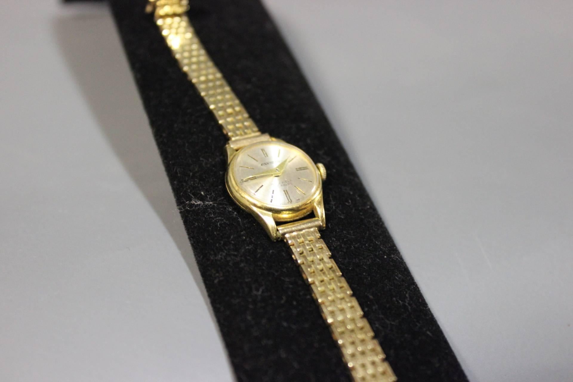 candino gold watch