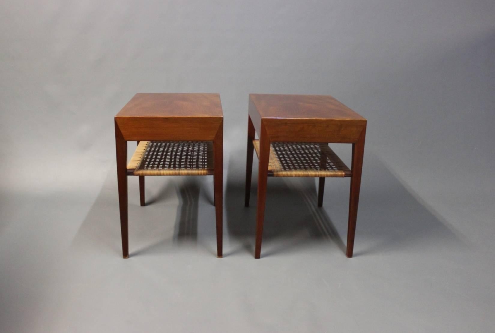 A pair of side tables manufactured by Haslev Furniture Factory and designed by Severin Hansen in the 1960s. The tables are in rosewood and cane.