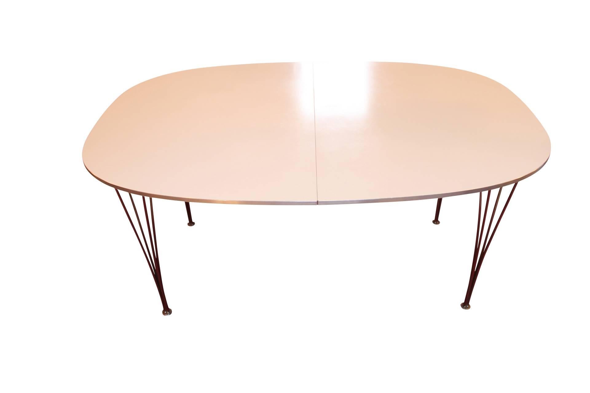 The extension table model B618, designed by Piet Hein and Bruno Mathsson in 1968 and manufactured by Fritz Hansen, is a versatile and iconic piece of furniture.

Piet Hein was a Danish mathematician, designer, and inventor, while Bruno Mathsson was