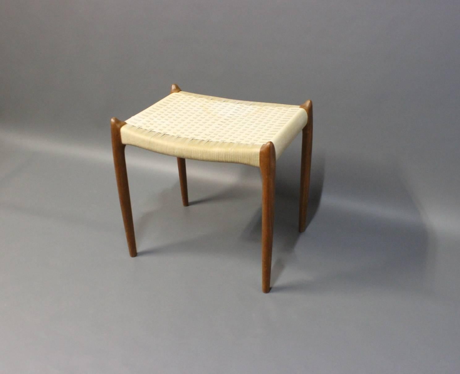 Small stool, model 80 A, with legs of teak and seat of white cord designed by NO. Møller and manufactured by J.L. Møller. The stool is of Danish design and from the 1960s.