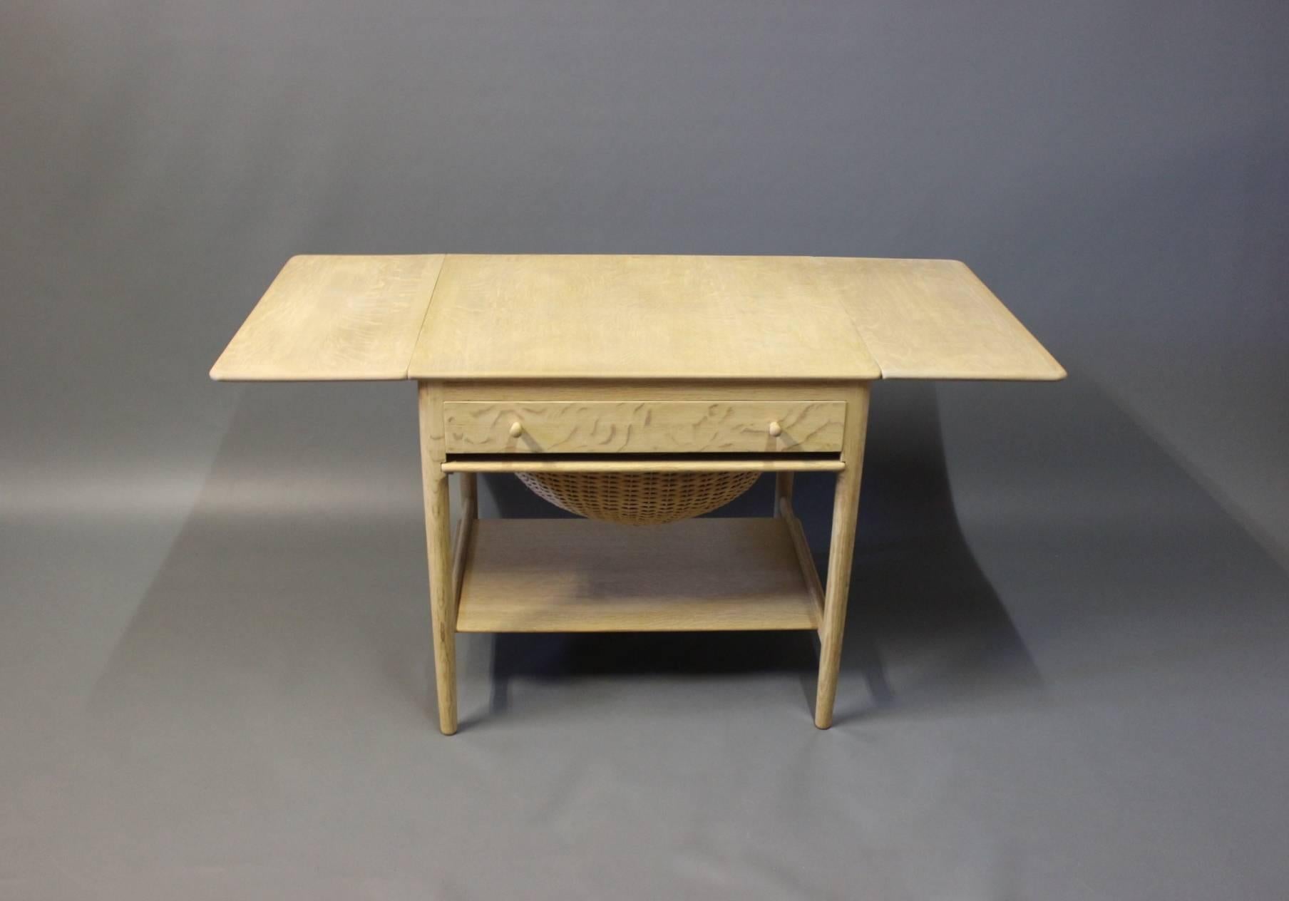 Sewing table in soap treated oak, model AT-33, designed by Hans J. Wegner in 1950 and manufactured by Andreas Tuck in the 1960s.