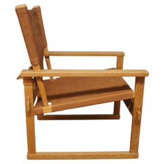 Sedia da salotto in Oak e pelle patinata marrone di Poul Hundevad, anni '60