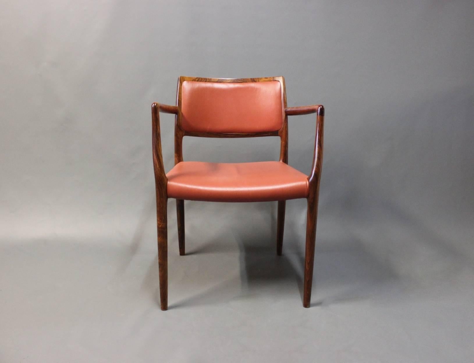 Armchair, model 65 manufactured by J.L. Moeller and designed by N.O. Moeller in 1968. The chair is in rosewood and red classic leather.
