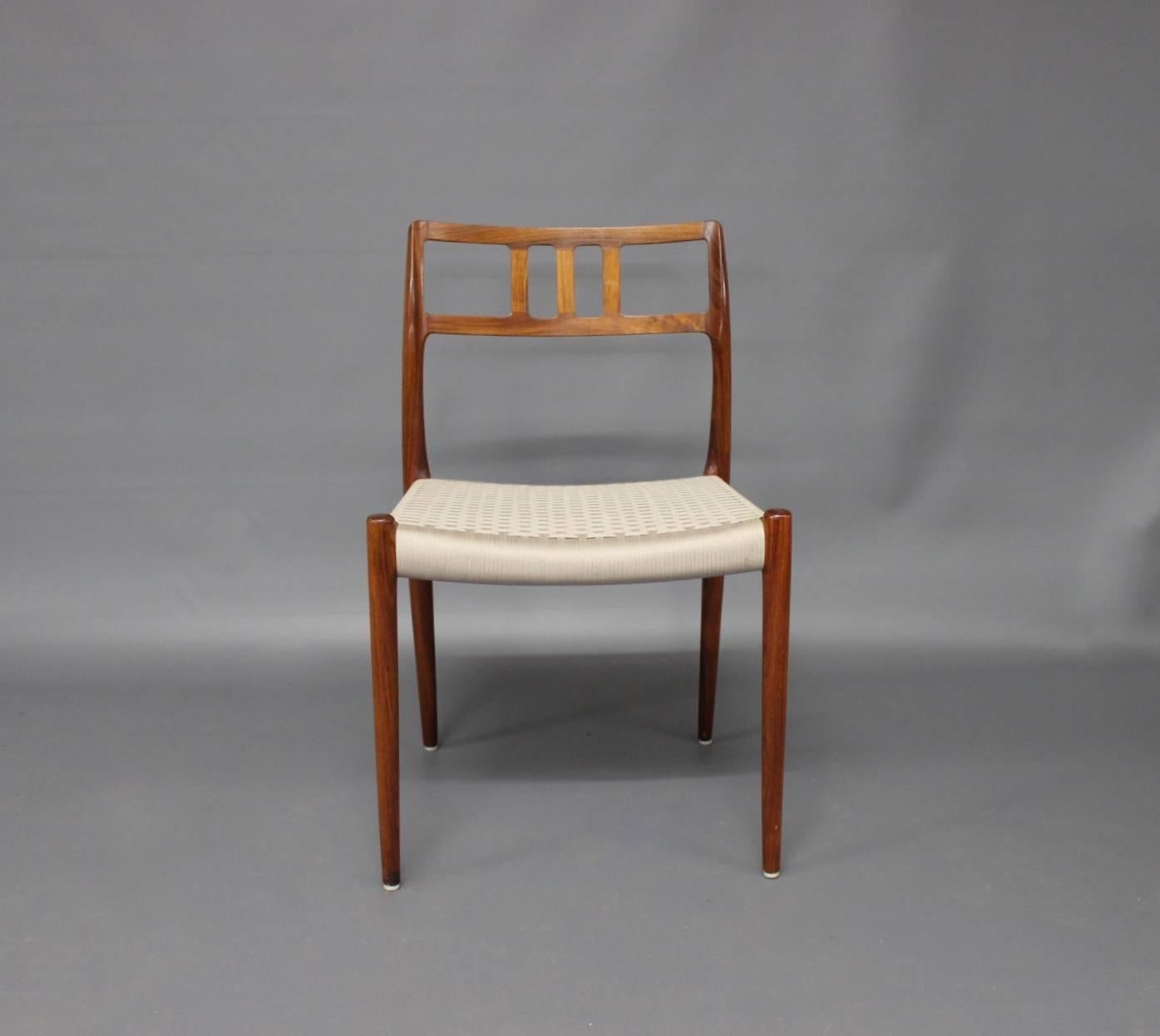 A set of six dining room chairs, model 79, designed by N.O. Moeller in 1966 and manufactured by J.L. Moeller in the late 1960s. The chairs are made of rosewood and light grey seats.