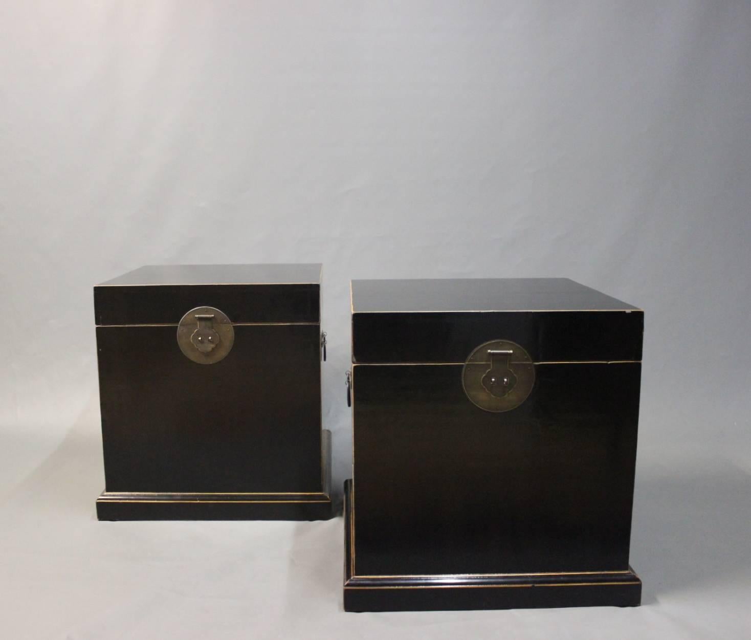 Chinese black lacquered chests from the 1940s. The chests are of wood and with brass locks.