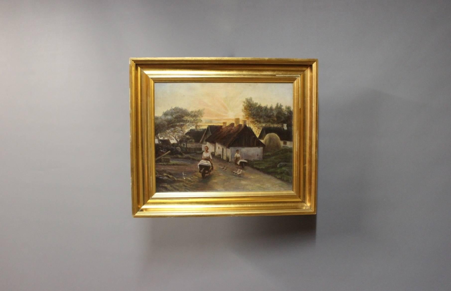Oil painting on canvas of a sunrise in the country signed by the Danish painter J. Jensen, 1916 with wooden frame decorated with gold-leaf.