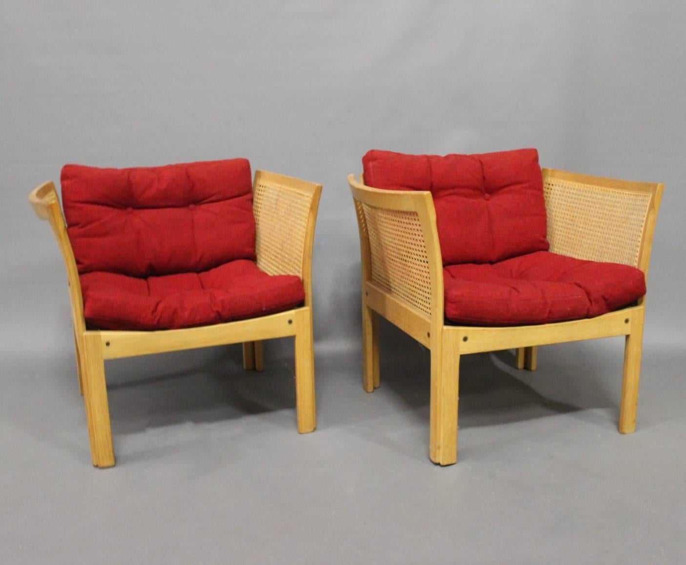 A pair of easy chairs in oak designed by Rud Thygesen and Johnny Sørensen, manufactured by CFC Silkeborg in the 1960s.