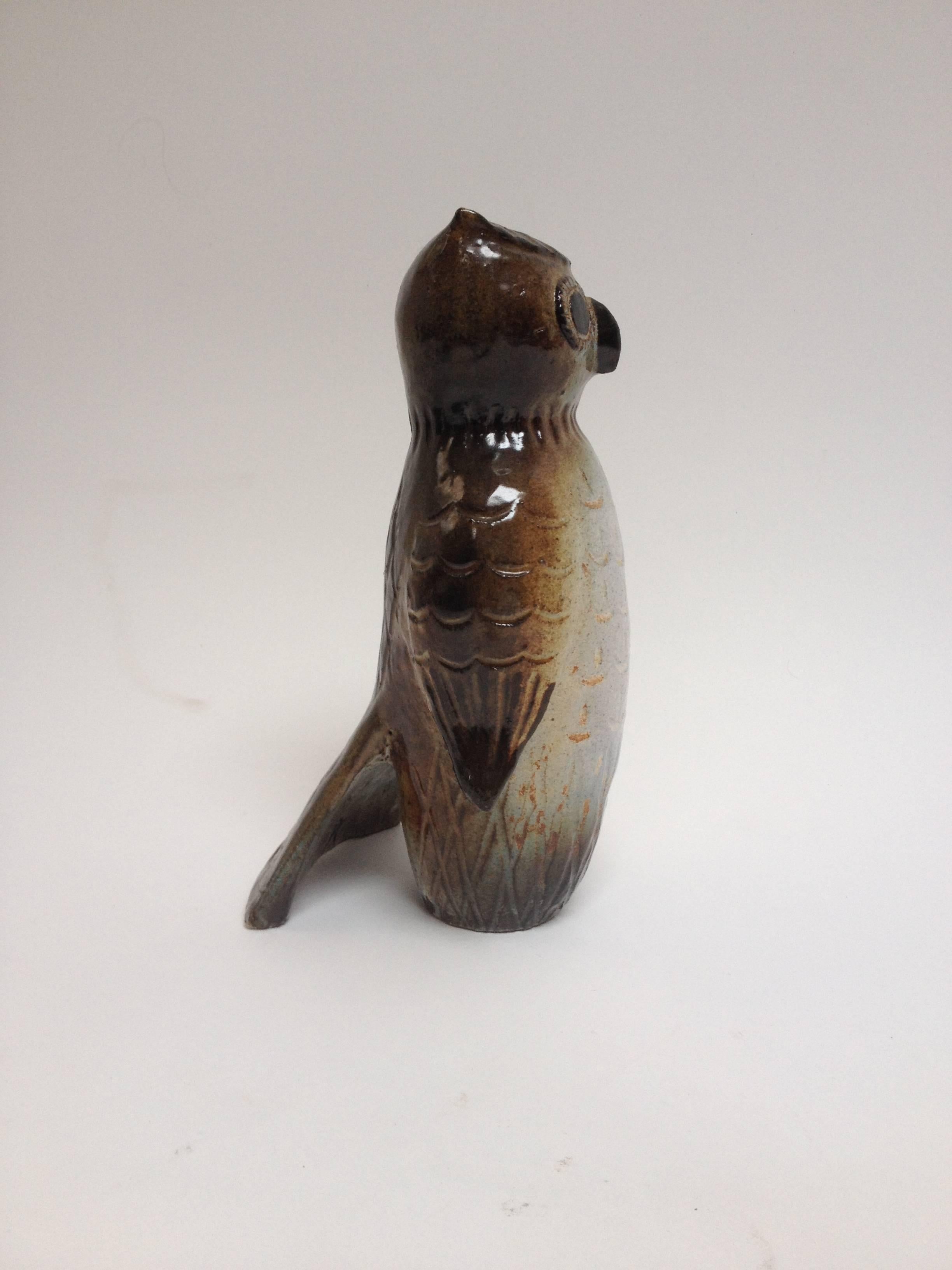 this Ceramic beauty was potted by renowned Japanese/Canadian Artist Thomas Kakinuma, Known for his bird sculptures.. this owl is in excellent condition.. there is a small hole(by artist ) on the side - wondering if he was originally going to make a