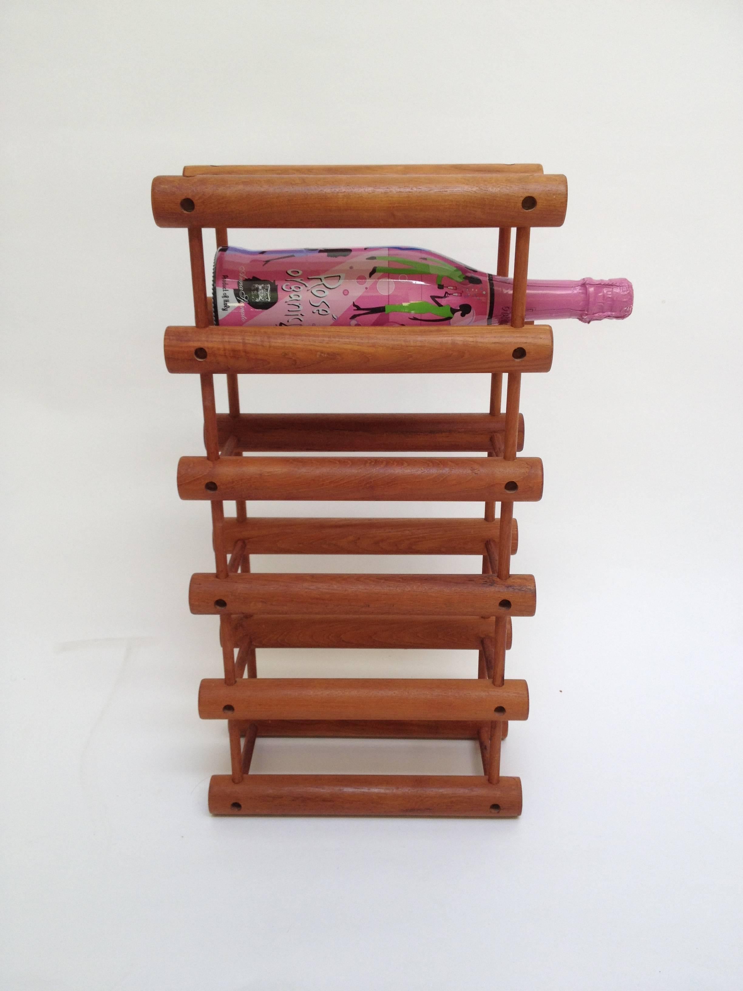Fabulous modular Mid-Century Modern teak wine rack, designed by Richard Nissen, made in Denmark, use horizontally or vertically, when it is vertical you can get six bottles and if you have the space to use horizontally you can get ten bottles.
