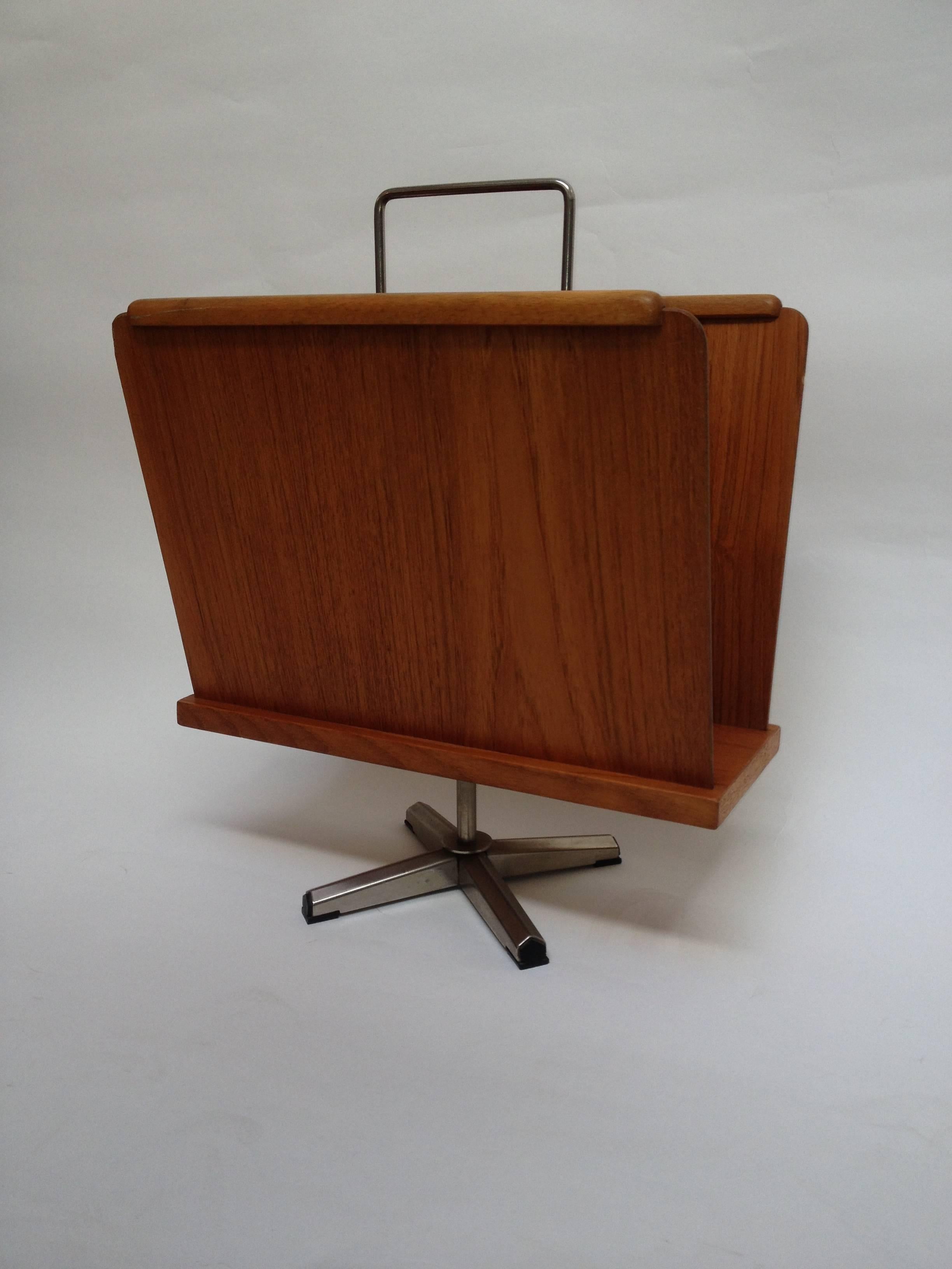 Fabulous 1960s teak/metal magazine rack that swivels, made in Norway. It is in good vintage condition with some wear to one of the corners see photo. Would look fabulous in your Mid-Century abode.
