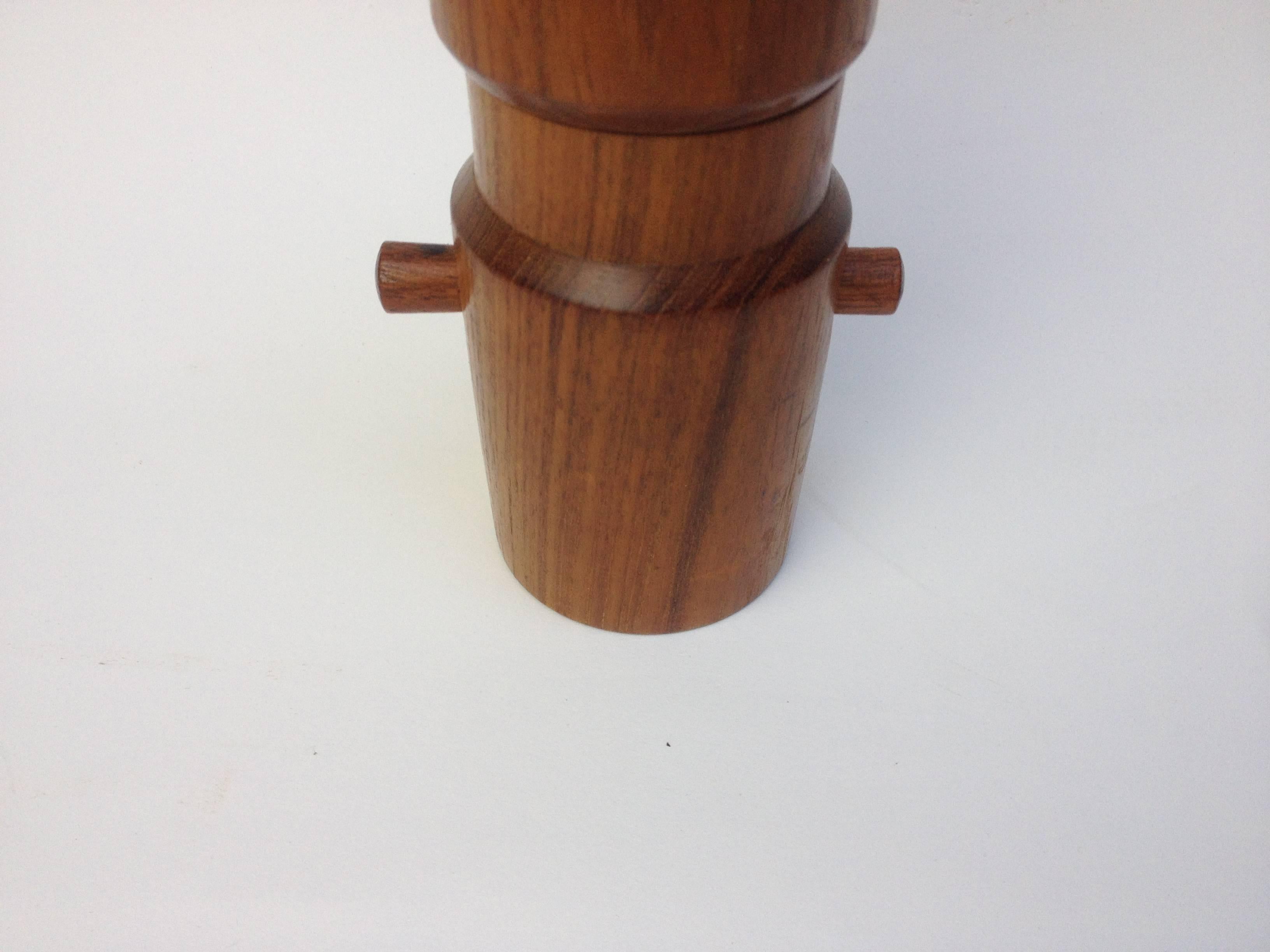 Fabulous teak pepper mill designed by Jens Quistgaard for Dansk Designs, with peugeot grinder, fantastic condition, form and function, true works of art. The mechanism works well.