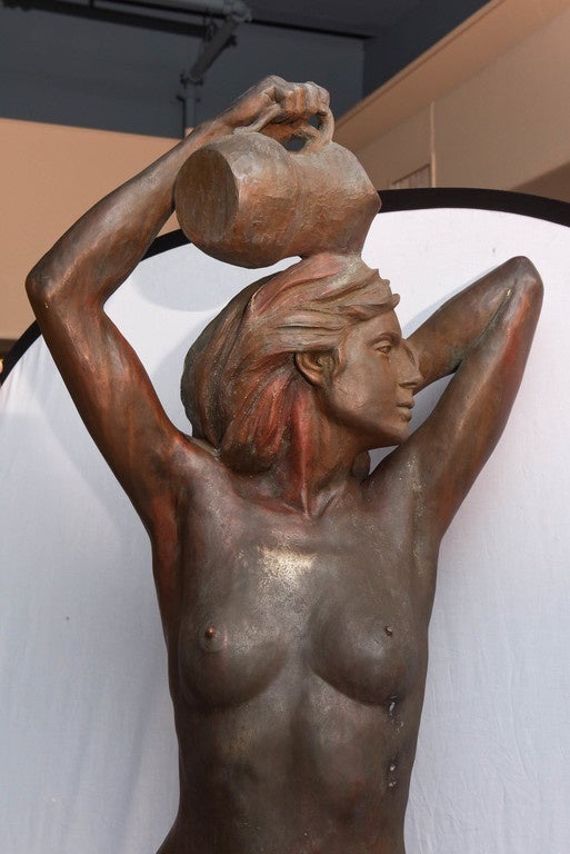 Fabulously formed female nude posed with a pitcher from which the water flows.
The base is fitted with a removable panel for connection to its interior copper tubing.
The sculpture is finely detailed from the tips of her toes to the top of her