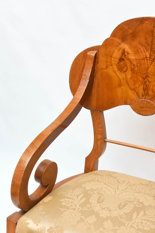 Outstandingly handsome pair of Biedermeier chairs. Superb honey-colored veneer with natural wood grains.