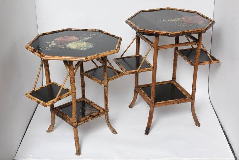 Each of the two bamboo tables is finely refinished with decoupage peonies over black lacquer.